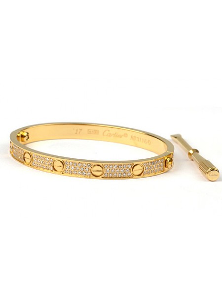 Cartier Love Screw bangle bracelet in yellow gold with diamonds