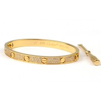 Cartier Love Screw bangle bracelet in yellow gold with diamonds	