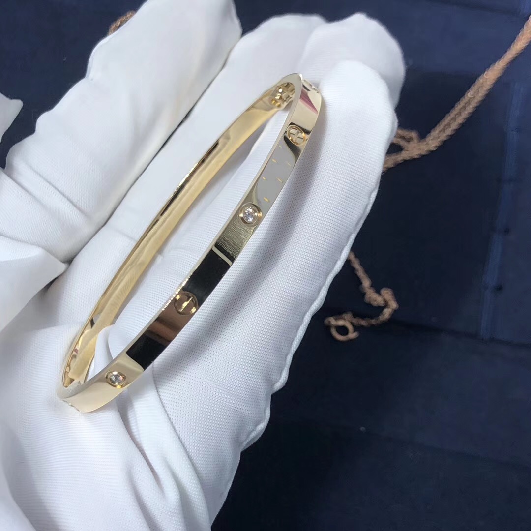 A Cartier Love 18k Yellow Gold Bracelet. Weight: 23.8