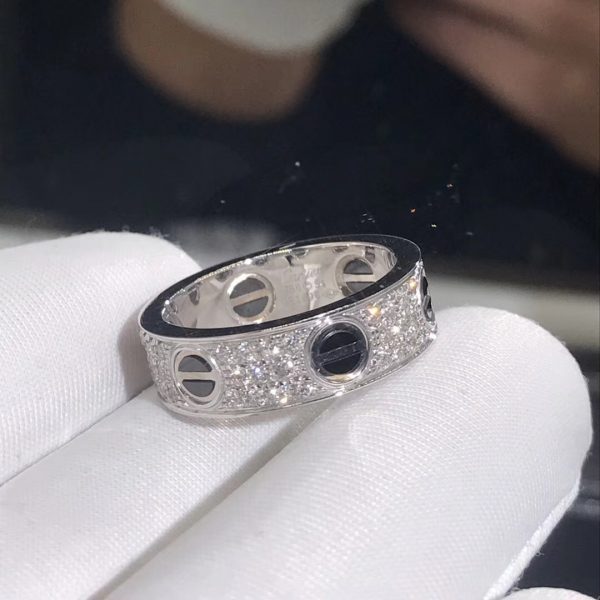 Cartier Love ring, 18K white gold, black ceramic, set with 66 brilliant-cut diamonds totaling 0.74 carats. Width: 6.5mm. Material: Pure 18K Yellow/Pink/White Gold Colors: Yellow Gold, Pink Gold, White Gold
