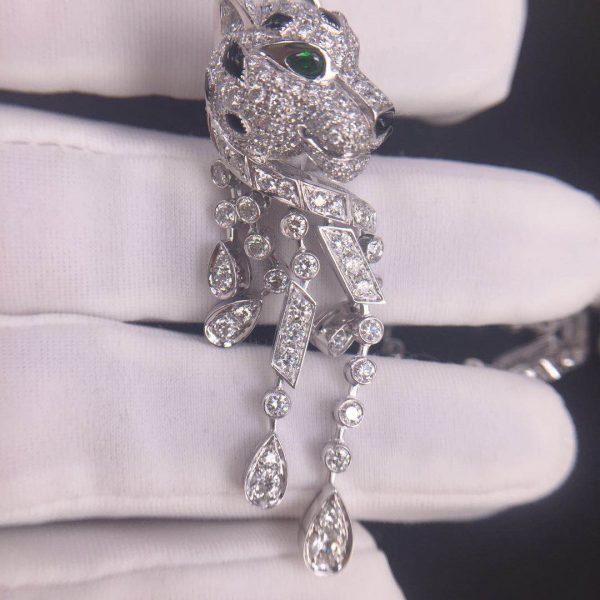Panthère de Cartier Earrings, 950‰ platinum, 310 brilliant-cut diamonds totaling 5.63 carats, emeralds, onyx.